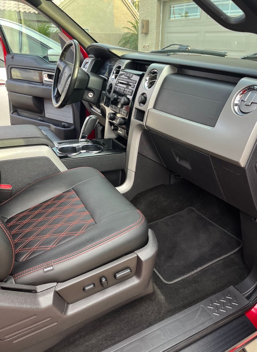 Ford F-150 interior after detailing, clean leather seats and dashboard