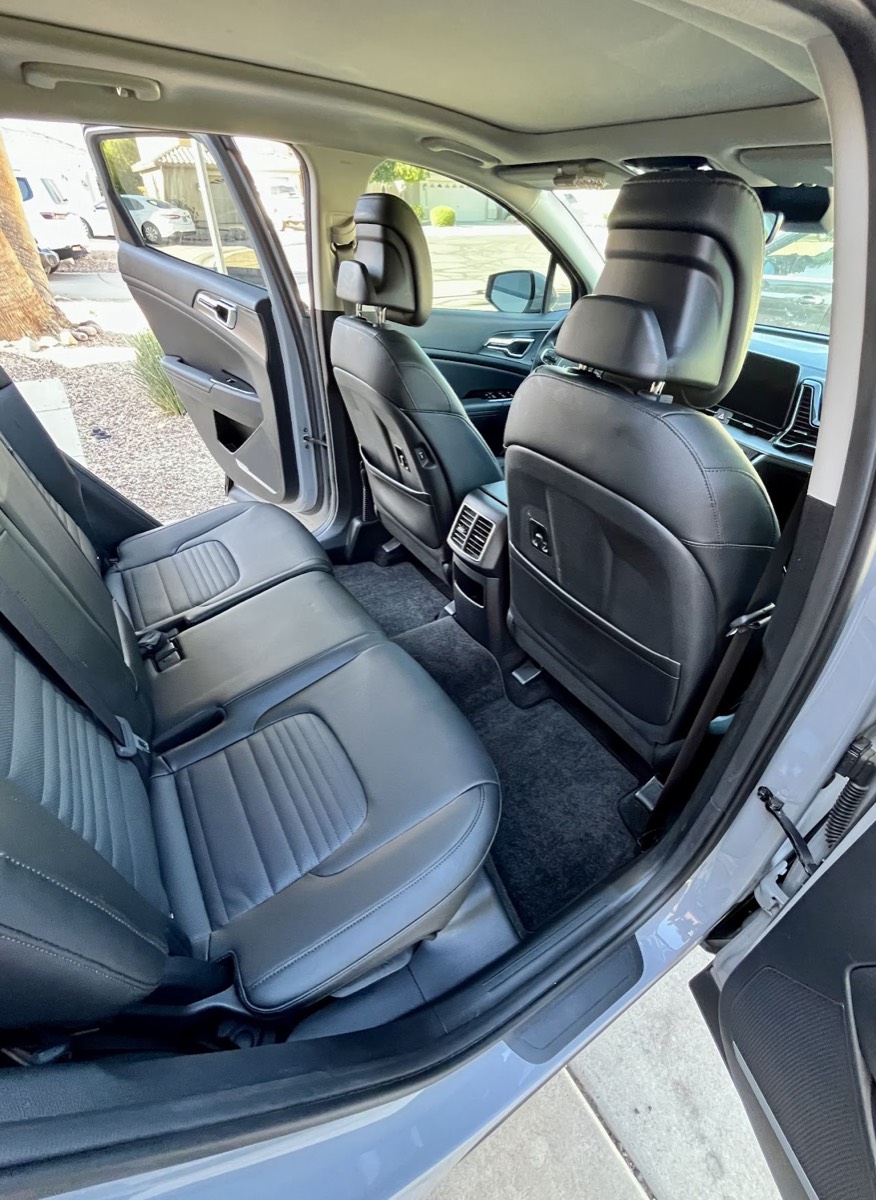 Clean SUV rear leather seats and carpets after heated extraction